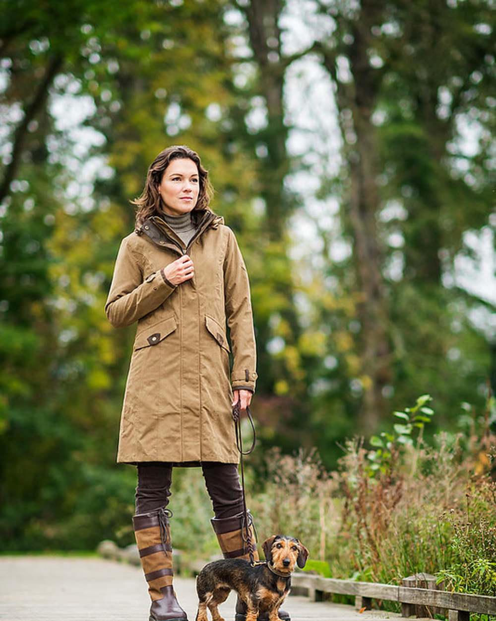 Camel Coloured Baleno Chelsea Mid Length Coat on countryside background 
