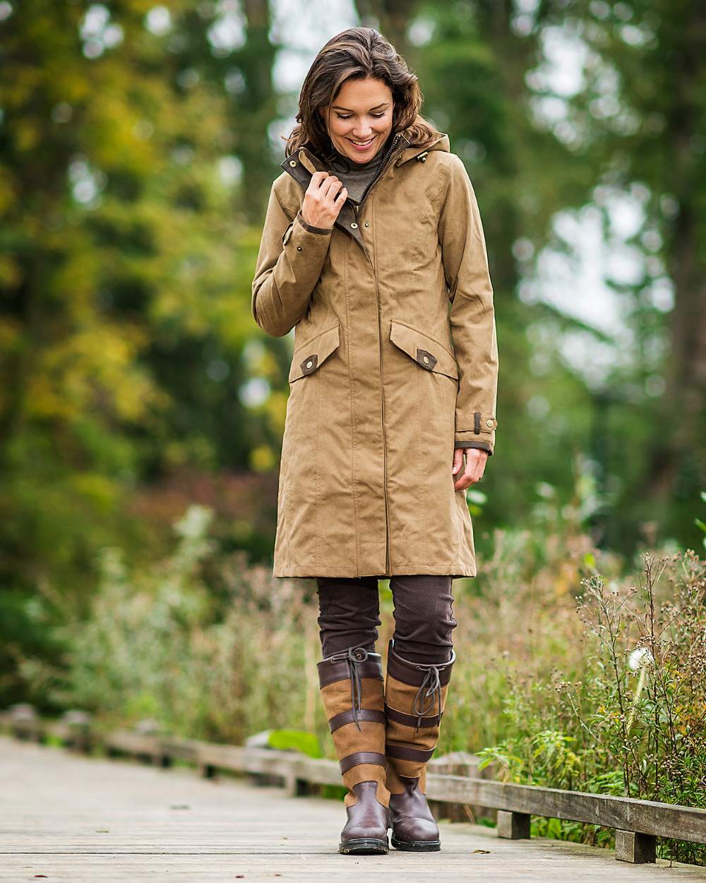 Camel Coloured Baleno Chelsea Mid Length Coat on countryside background 