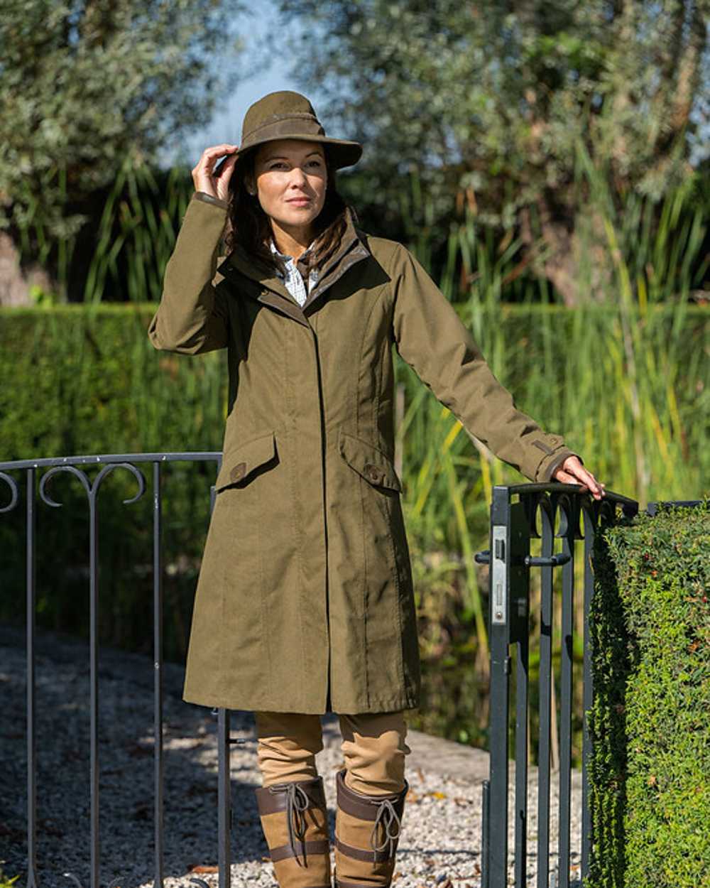 Pine Green Coloured Baleno Chelsea Mid Length Coat on garden background 