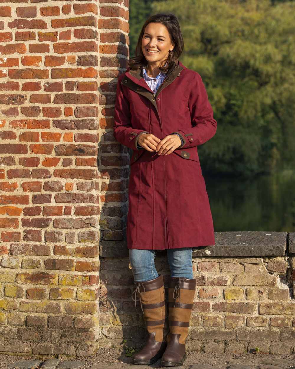 Raspberry Coloured Baleno Chelsea Mid Length Coat on pond background 