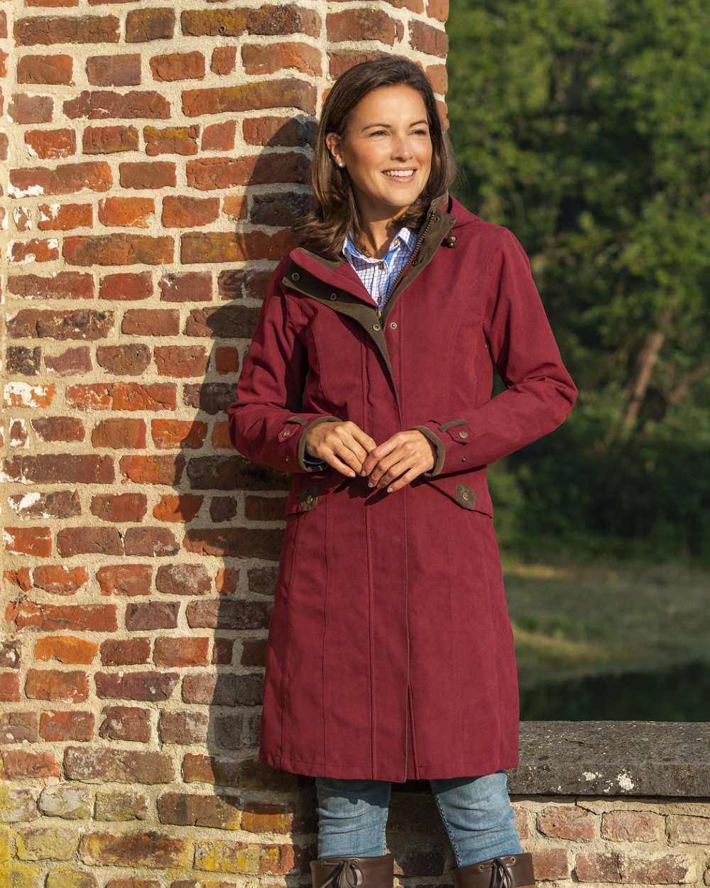 Raspberry Coloured Baleno Chelsea Mid Length Coat on pond background 