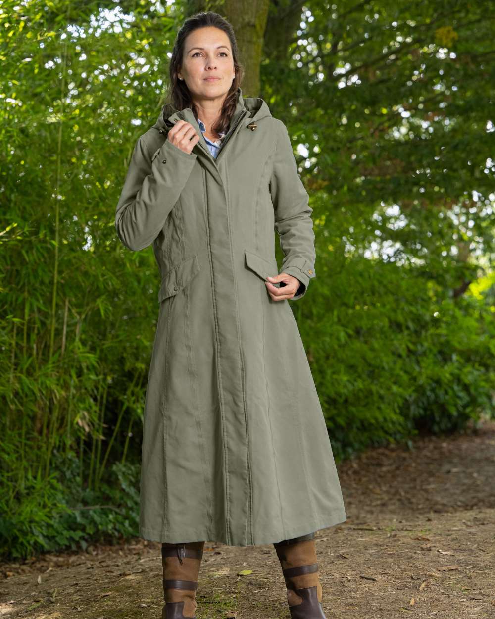 Grey Green Coloured Baleno Kensington Safe Womens Long Riding Coat On A Backyard Background 