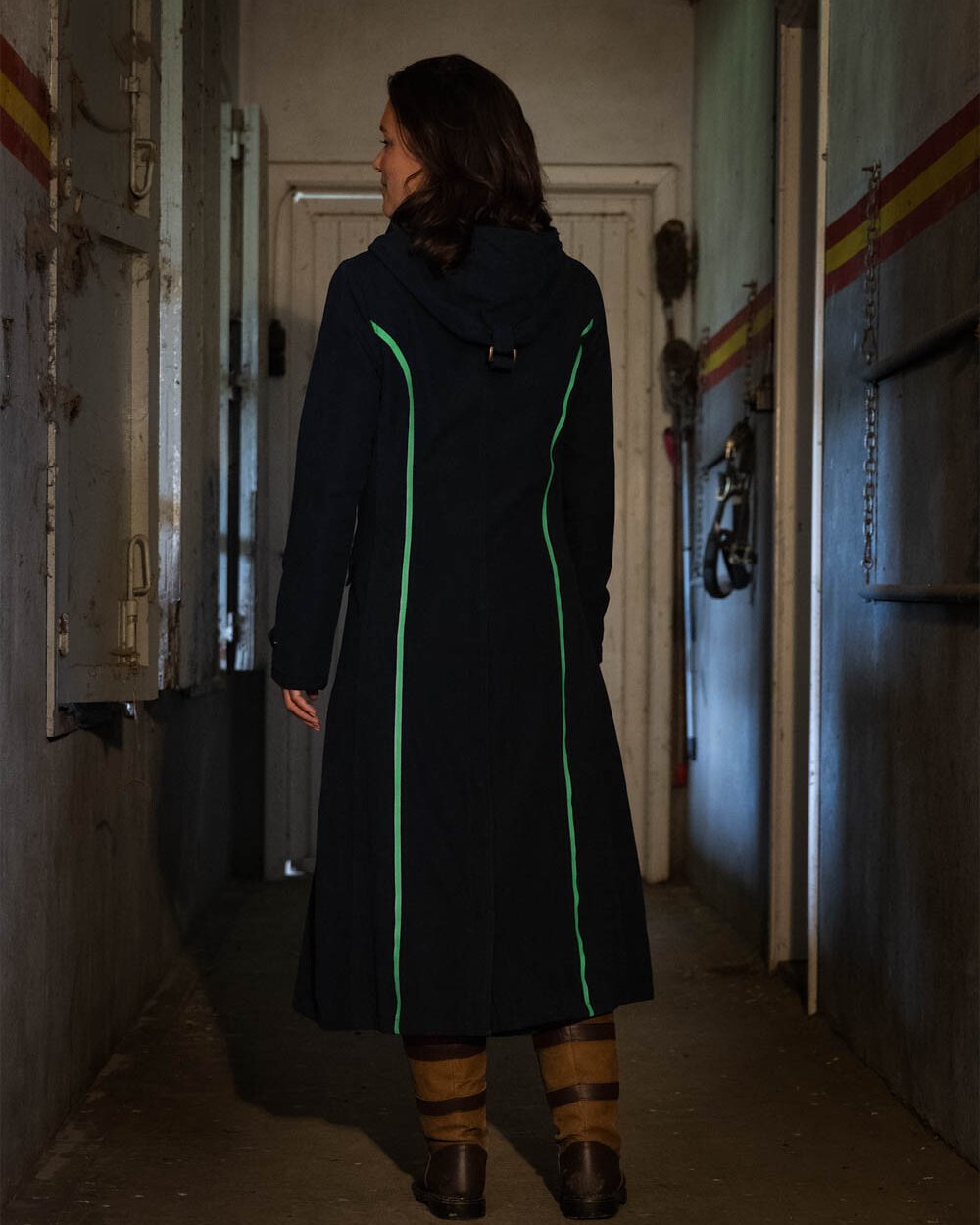 Navy Blue Coloured Baleno Kensington Safe Womens Long Riding Coat On A Stable Background 