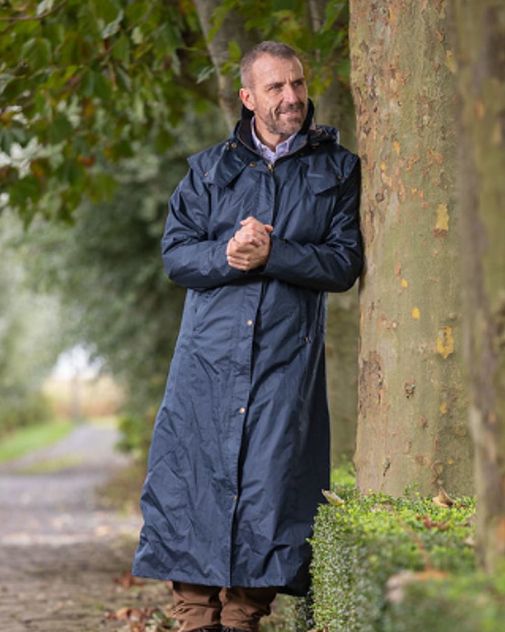 Navy Blue Coloured Baleno Newbury Waterproof Long Coat On A Street Background 