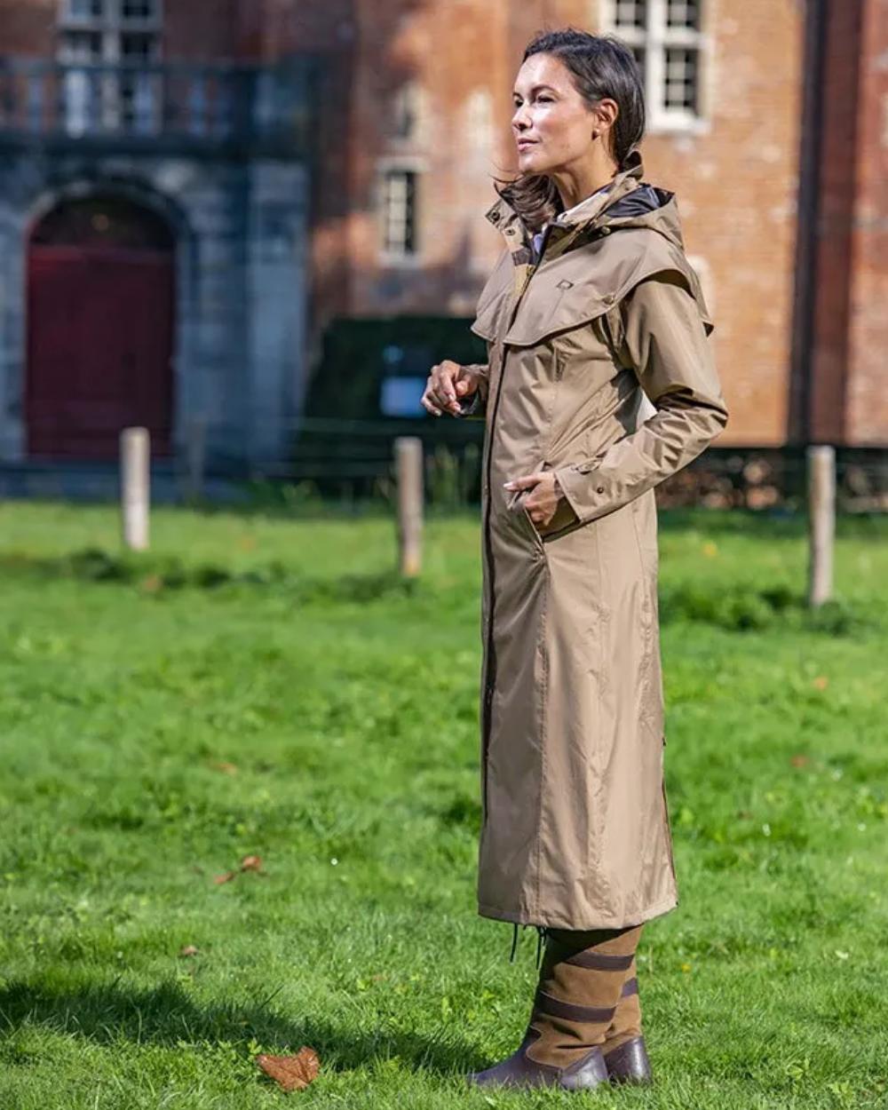 Camel Coloured Baleno Oxford Long Waterproof Coat On A Backyard Background 