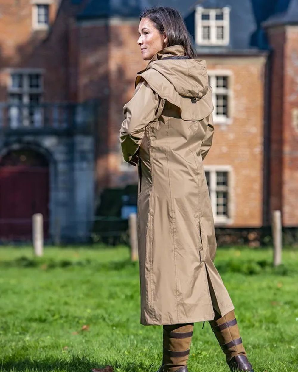 Camel Coloured Baleno Oxford Long Waterproof Coat On A Backyard Background 