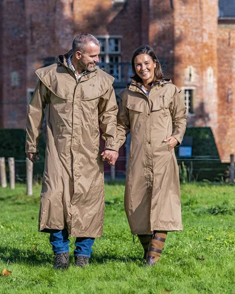 Camel Coloured Baleno Oxford Long Waterproof Coat On A Backyard Background 