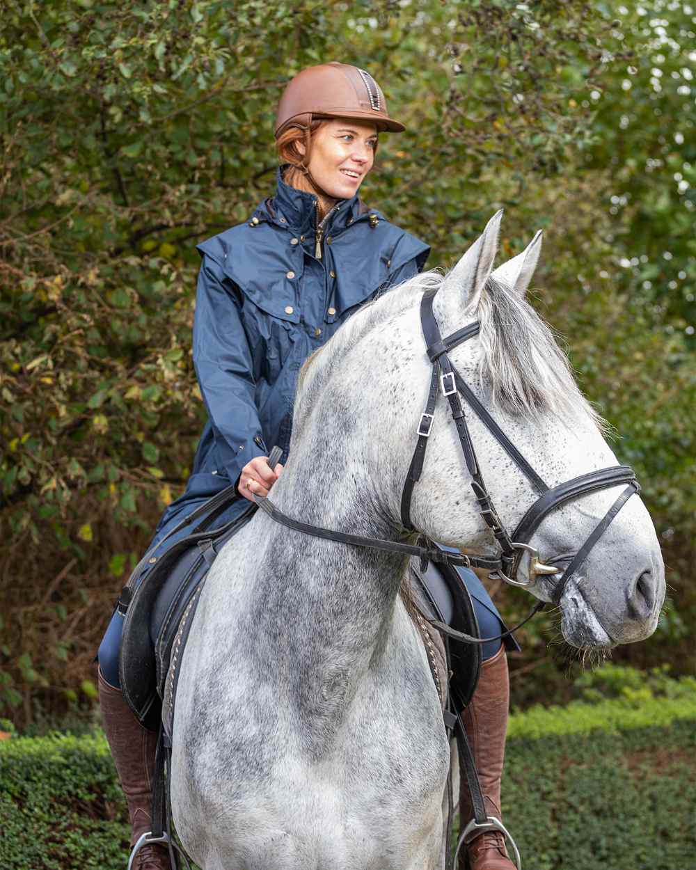 Navy Coloured Baleno Oxford Long Waterproof Coat On A Backyard Background 