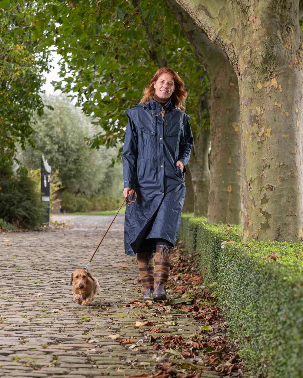 Navy Coloured Baleno Oxford Long Waterproof Coat On A Street Background 