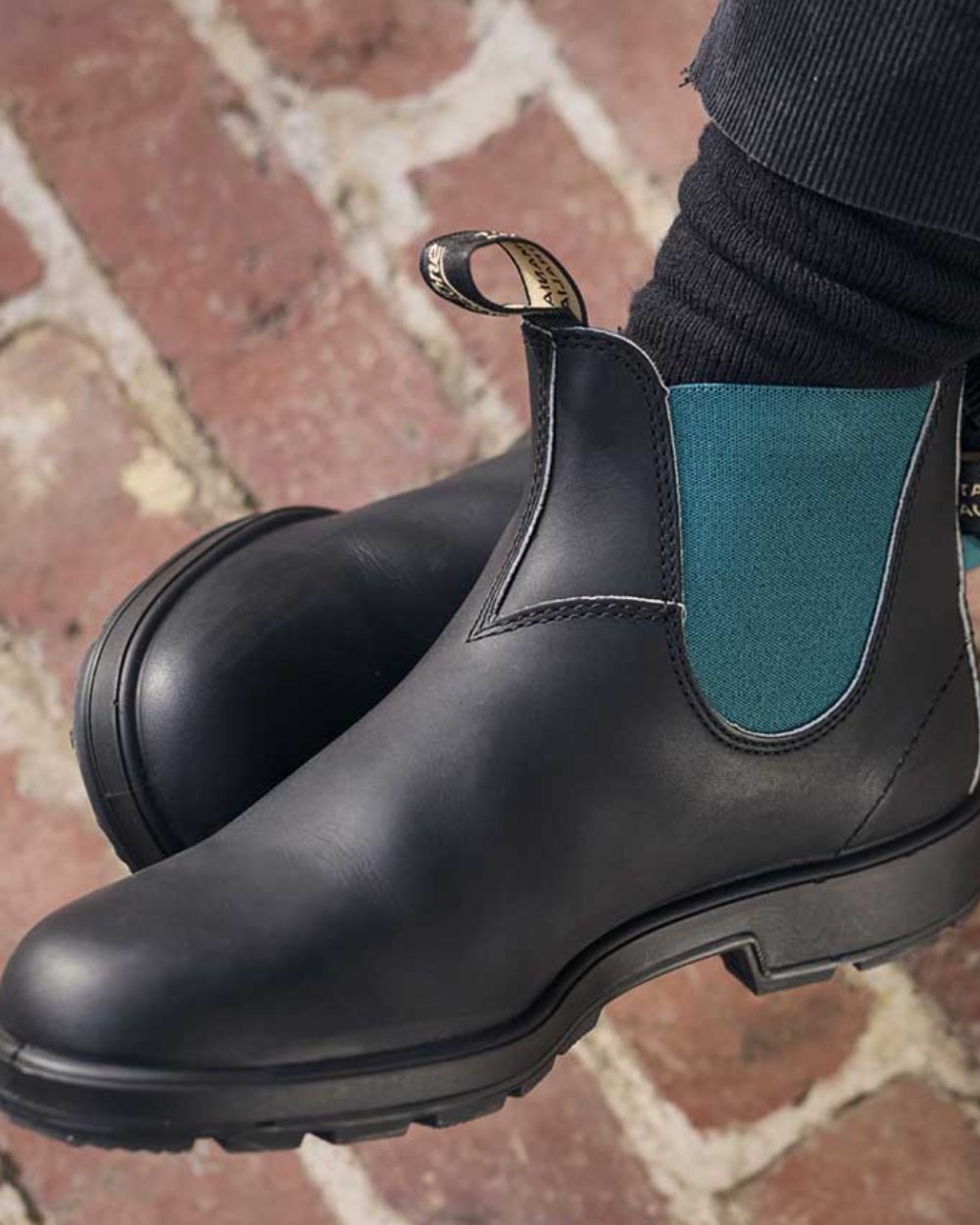 Black Green Coloured Blundstone 2307 Black Leather Chelsea Boots On A Street Background