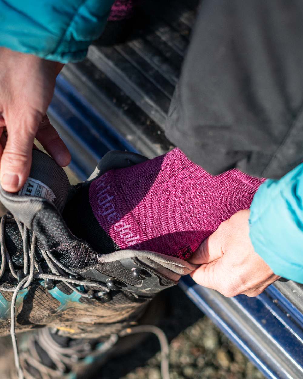 Berry Coloured Bridgedale Womens Lightweight Merino Performance Socks on Outdoor Background
