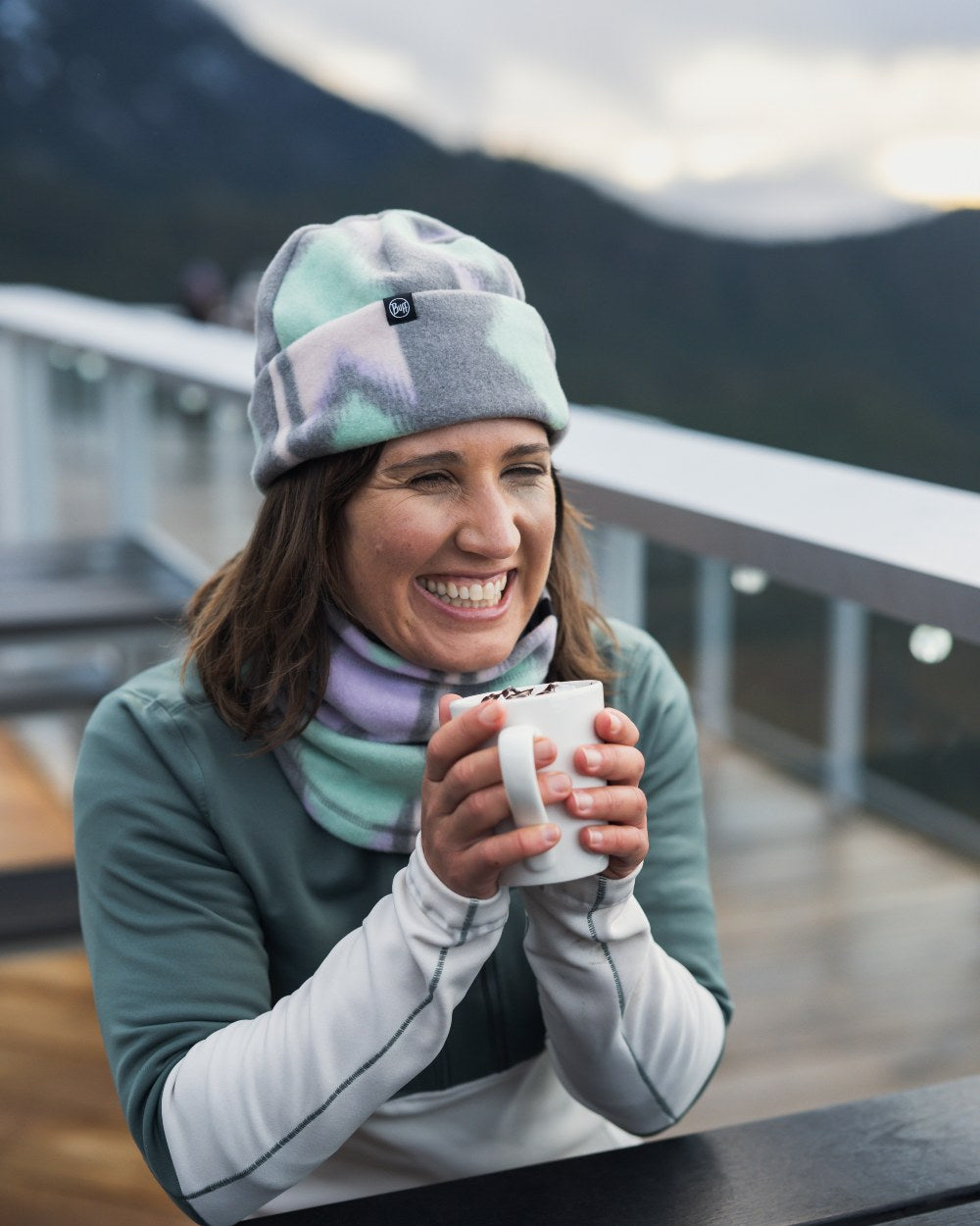Cusha Multi Coloured Buff Polar Prints Neck Warmer On A Mountain Background 