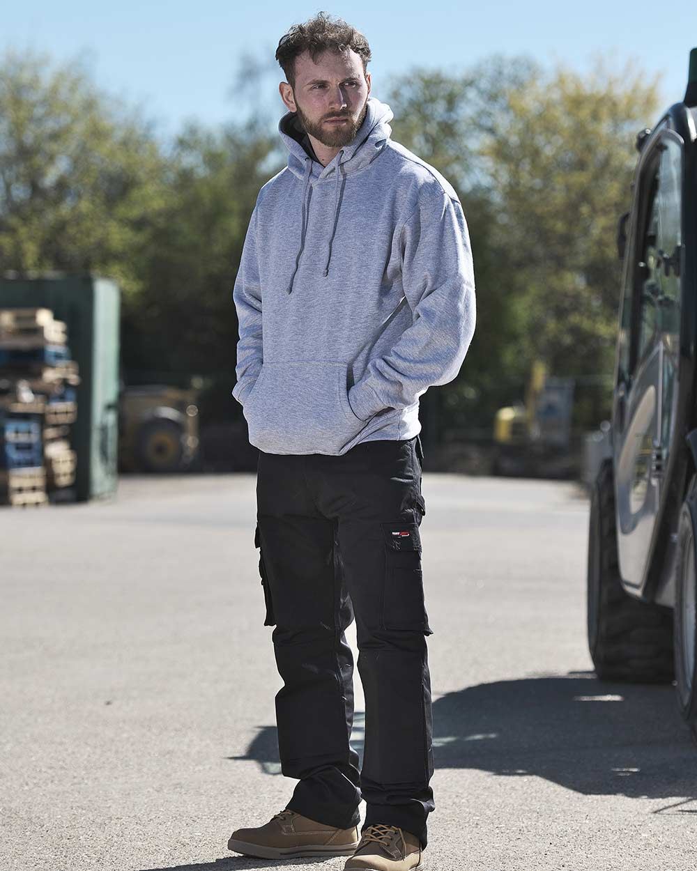 Black Coloured TuffStuff Pro Work Trousers On A Street Background 