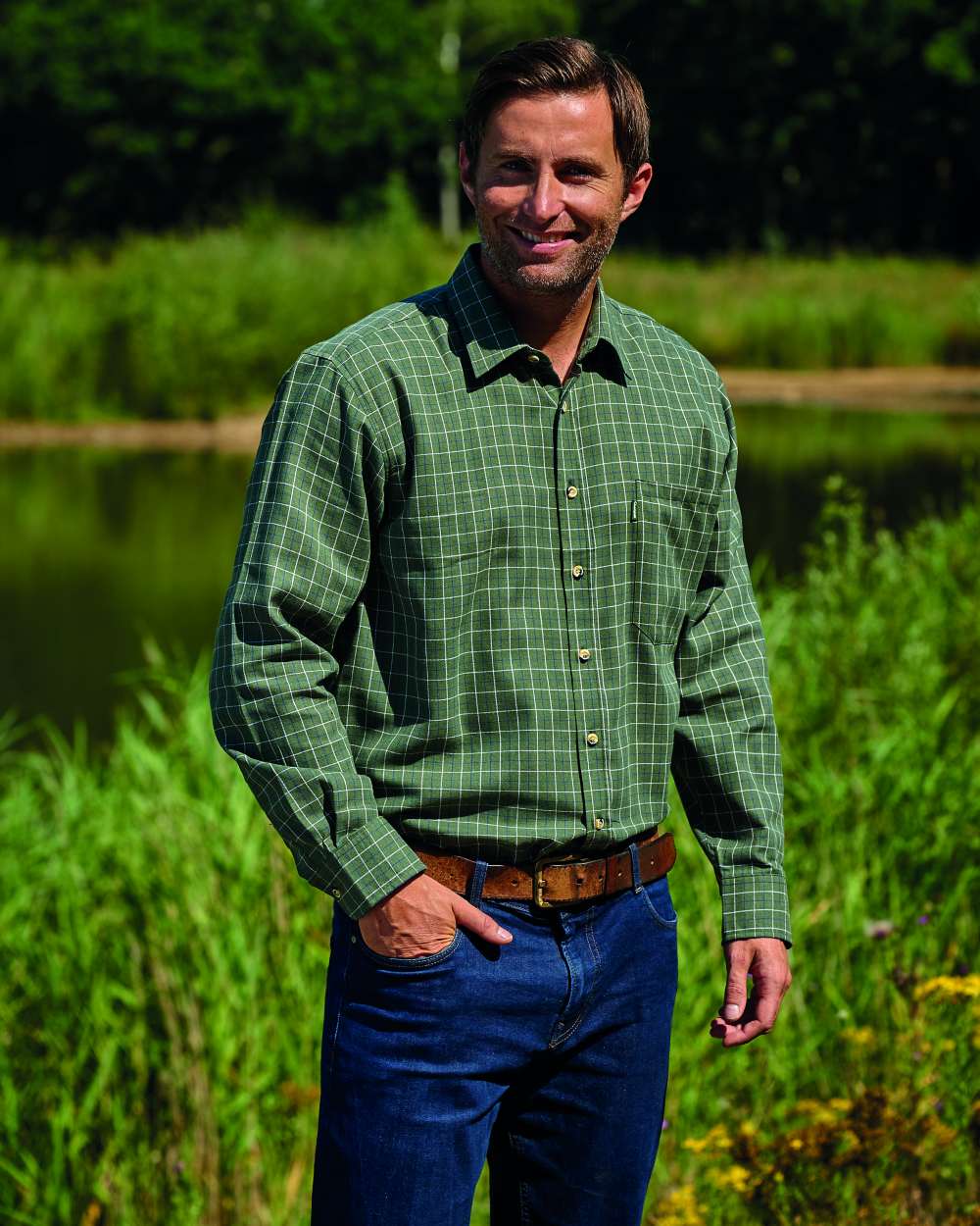 Olive Coloured Champion Castleton Polycotton Shirt On A Lake Background 