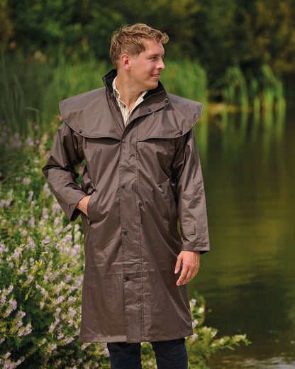 Brown Coloured Champion Highgrove Long Waterproof Coat On A Lake Background 