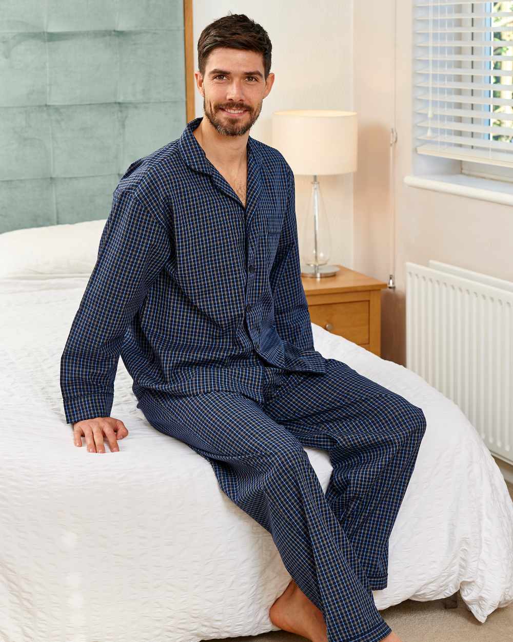 Navy Coloured Champion Marlow Pyjamas On A Bedroom Background 