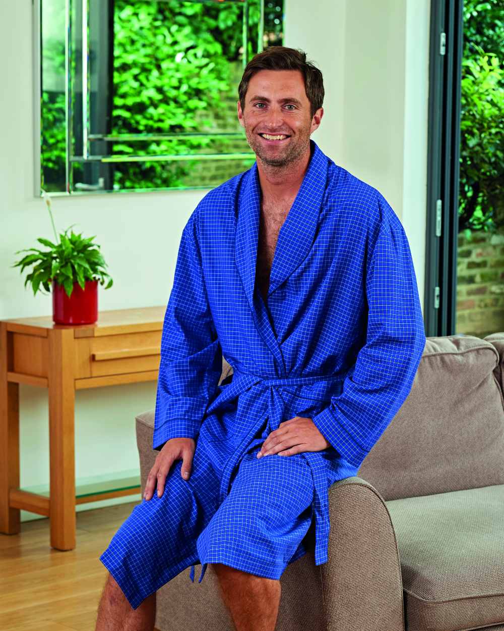 Light Blue Coloured Champion Regal Dressing Gown On A Wall Background 