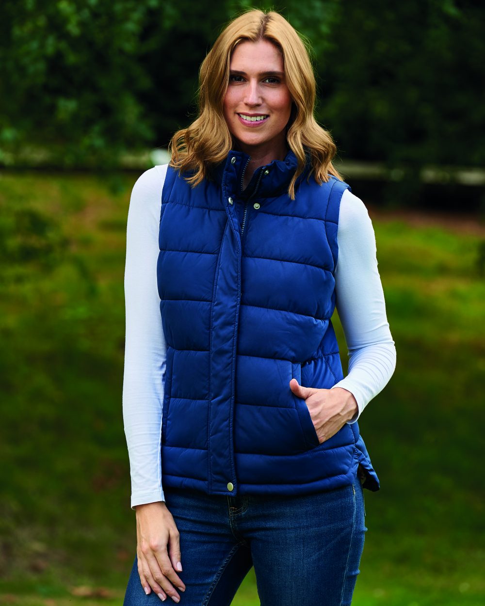 Navy Coloured Champion Vermont Ladies Quilted Gilet On A  Field Background 