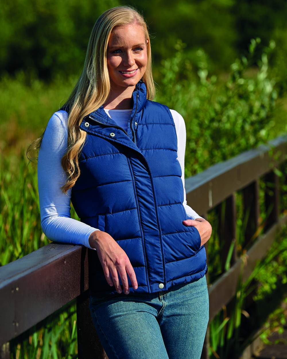 Navy Coloured Champion Vermont Ladies Quilted Gilet On A  Field Background 