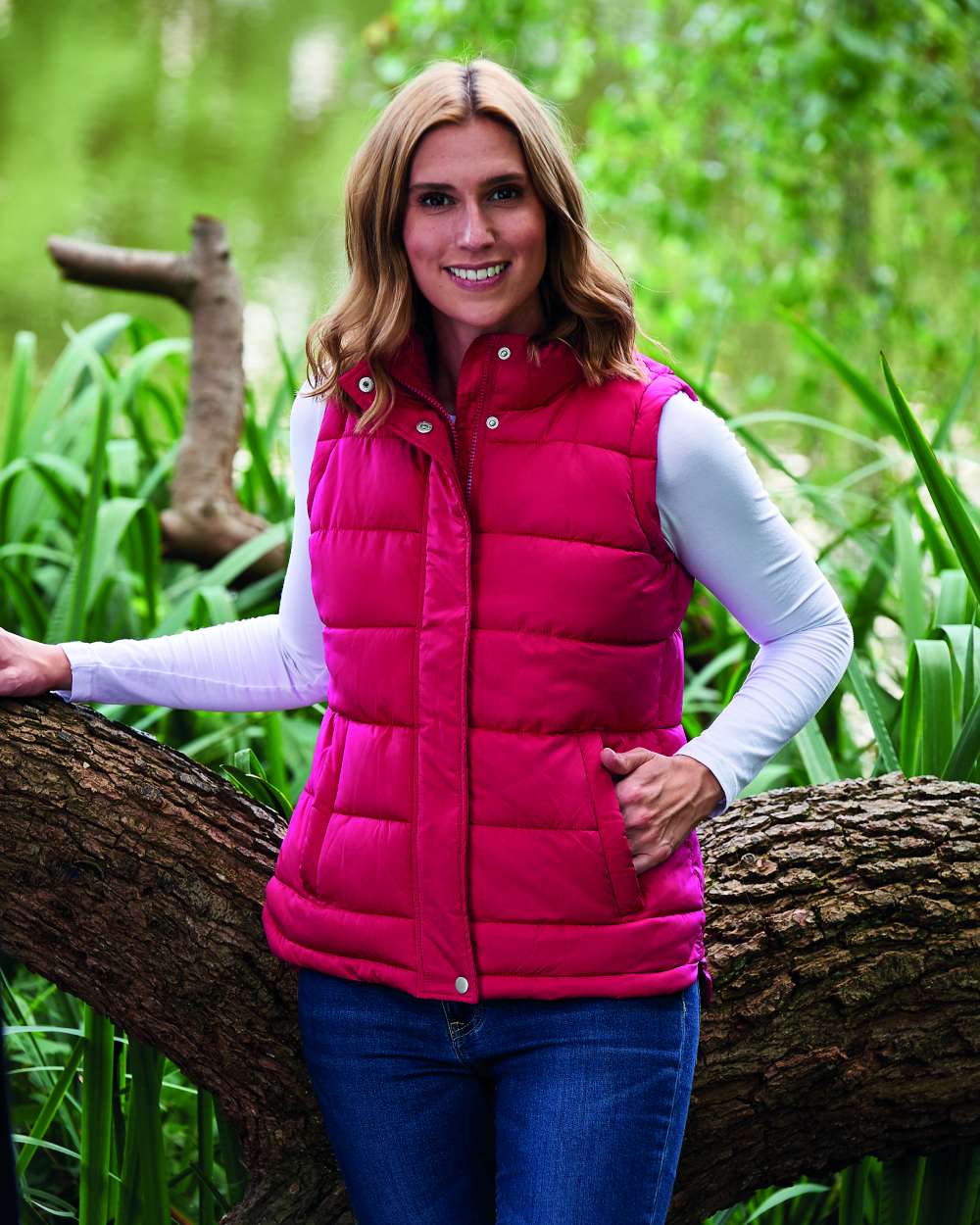 Rose Coloured Champion Vermont Ladies Quilted Gilet On A Field Background 