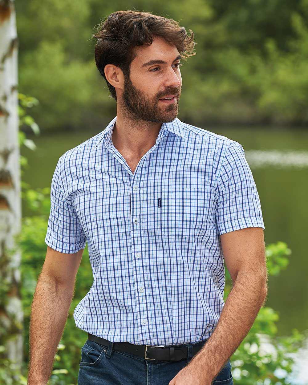 Blue Coloured Champion Whitstable Short Sleeve Shirt On A Pond Background 