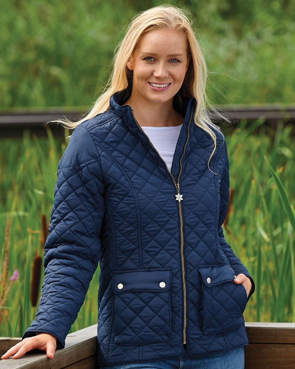 Navy Coloured Champion Wisley Quilted Jacket On A Forest Background