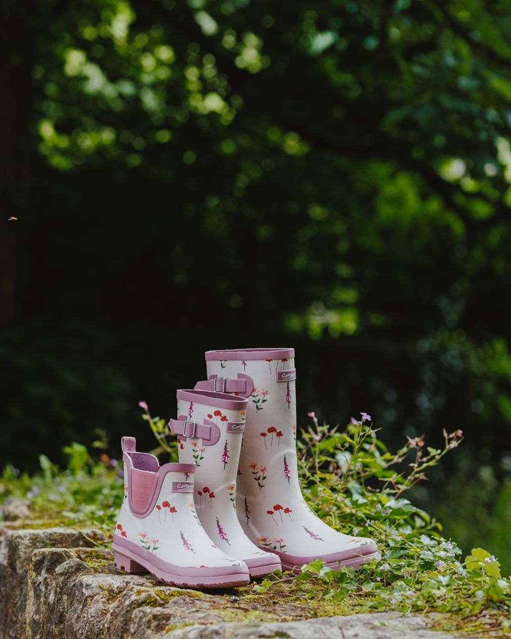Pink Coloured Cotswold Womens Wildflower Ankle Wellingtons on Outdoor Background
