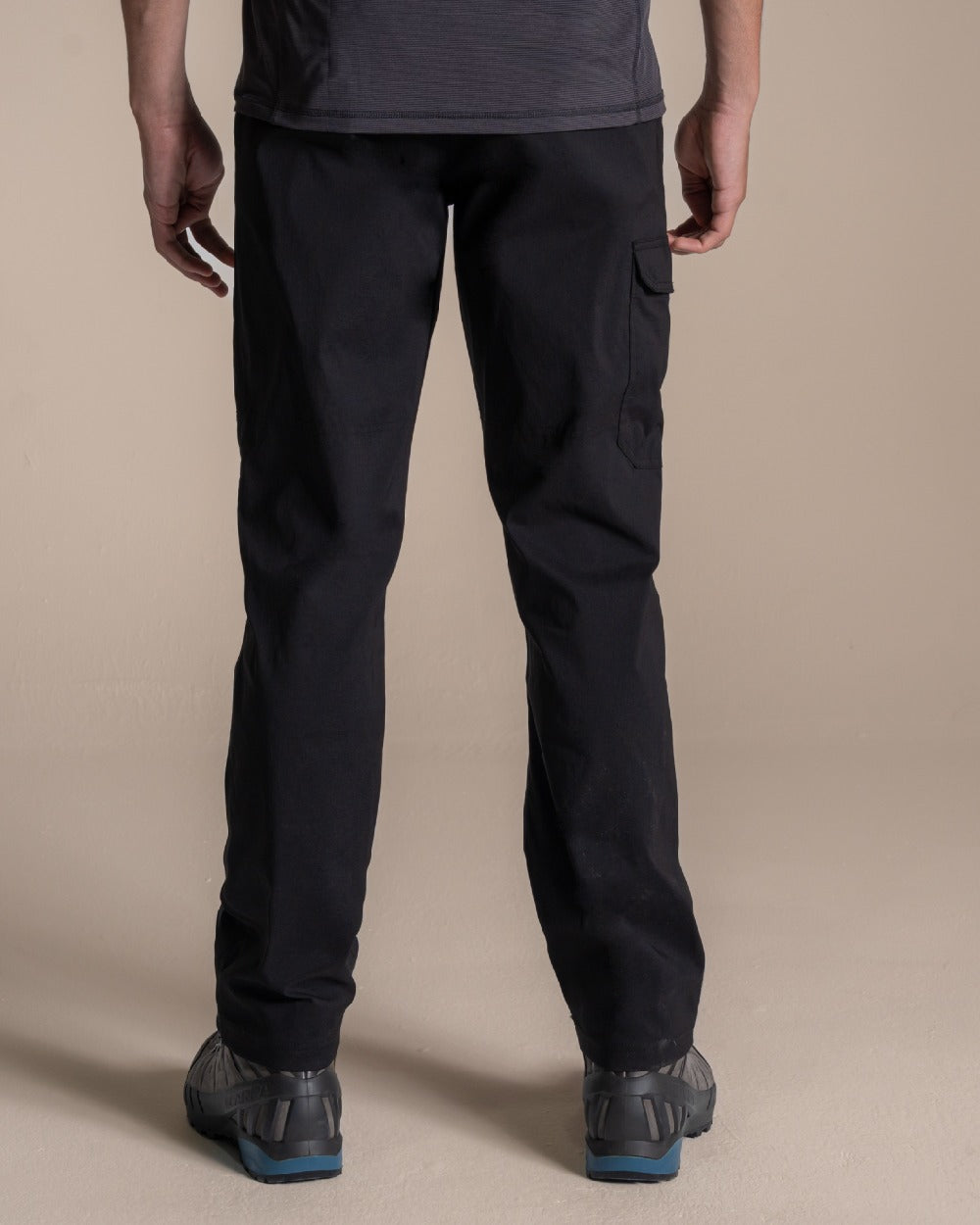 Black coloured Craghoppers Mens Brisk Pro Trouser on beige background 