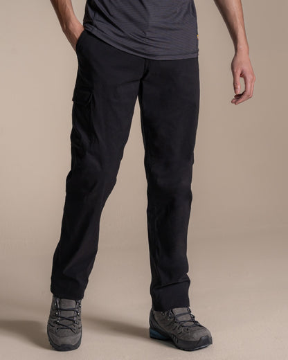 Black coloured Craghoppers Mens Brisk Pro Trouser on beige background 