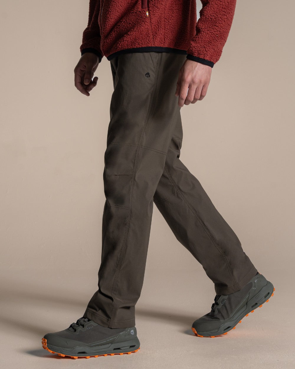 Woodland Green coloured Craghoppers Mens Brisk Pro Trouser on beige background 