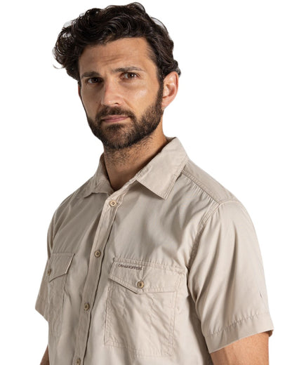 Oatmeal Coloured Craghoppers Mens Kiwi Short Sleeved Shirt On A White Background 