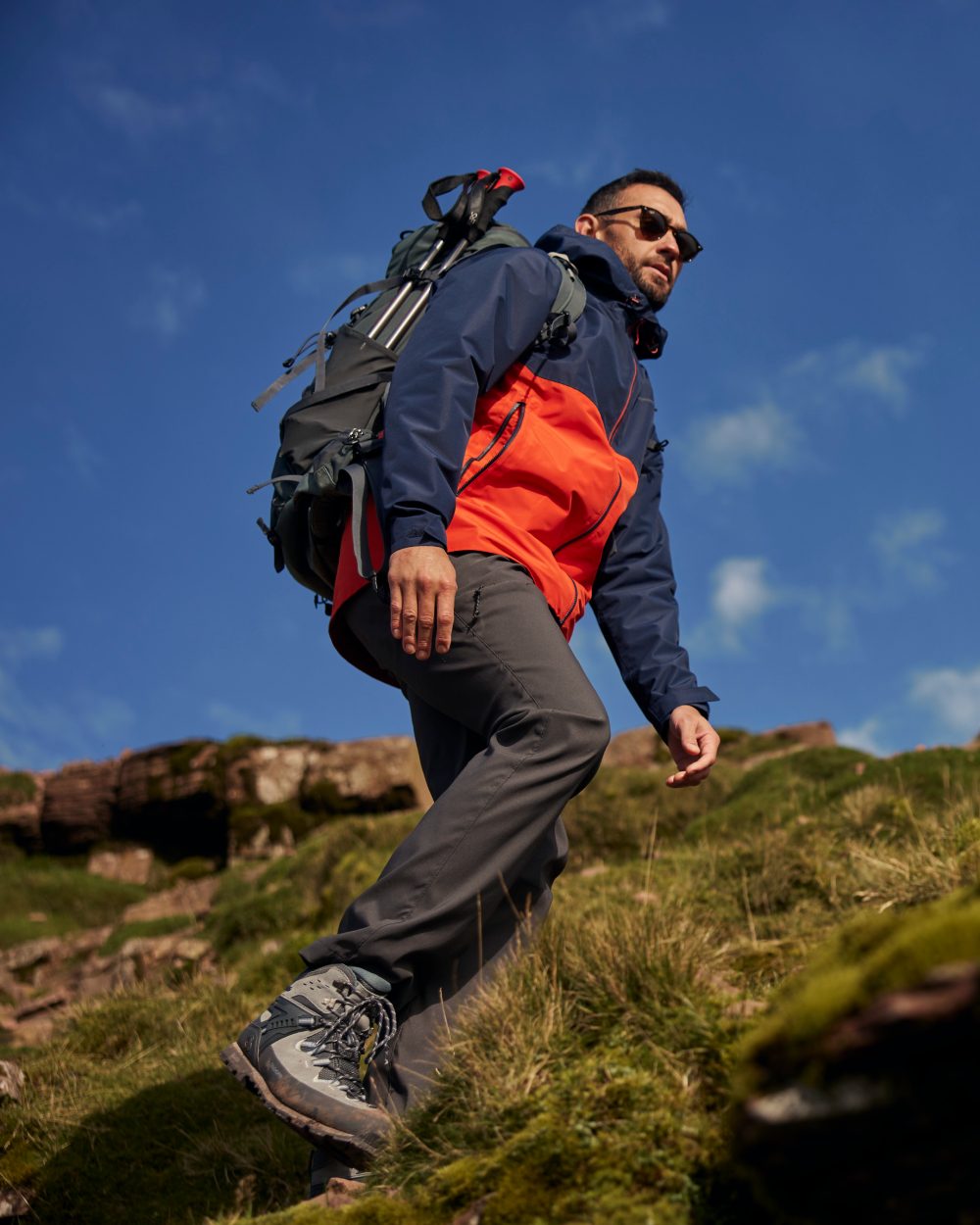 Blue Navy Pimento Red Coloured Craghoppers Mens Osuna Waterproof Jacket on Outdoor Background
