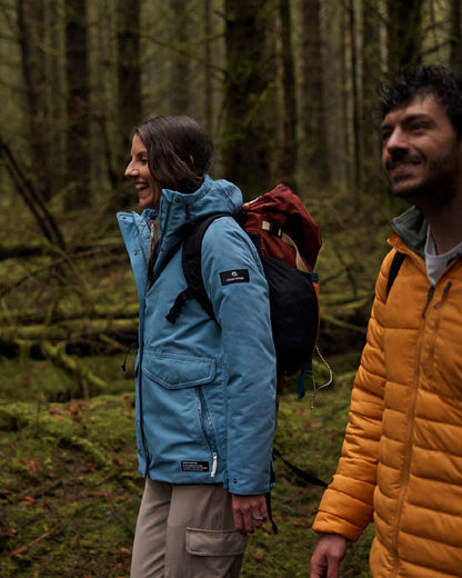 Light Denim Coloured Craghoppers Womens CO2 Renu Sally Waterproof Jacket on Outdoor Background
