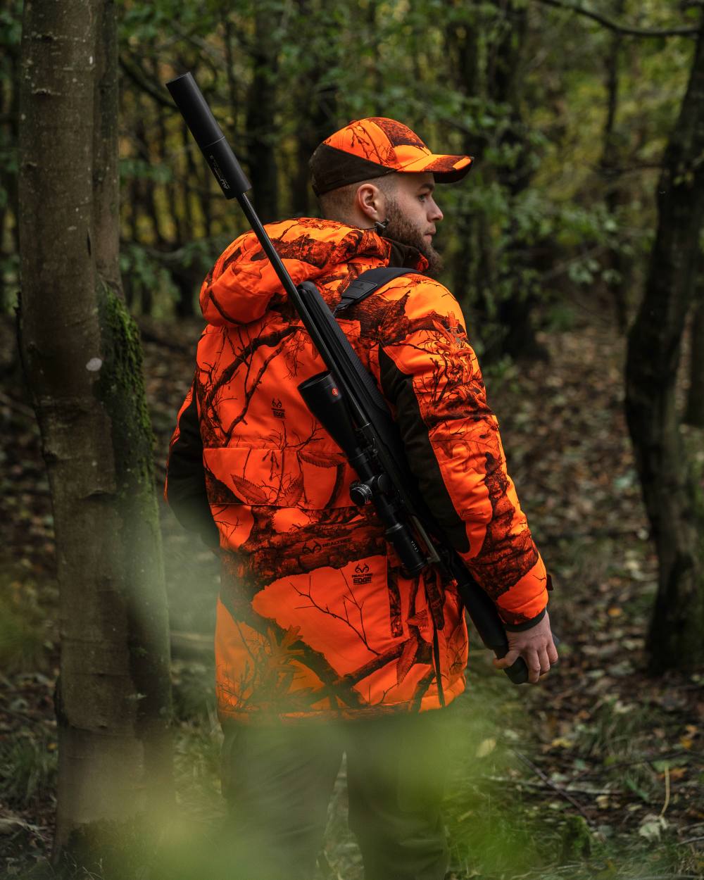 Realtree Edge Orange Coloured Deerhunter Eagle Cap On A Forest Background 