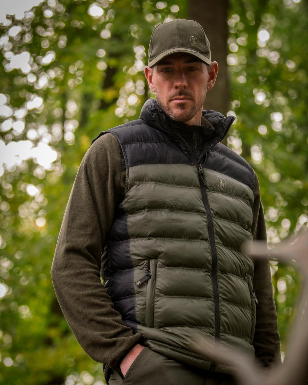 Tarmac Green Coloured Deerhunter Eagle Cap On A Forest Background 