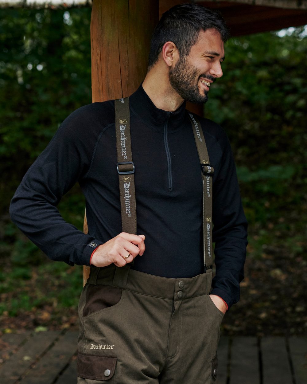 Tarmac Green Coloured Deerhunter Eagle Winter Trousers On A Forest Background 