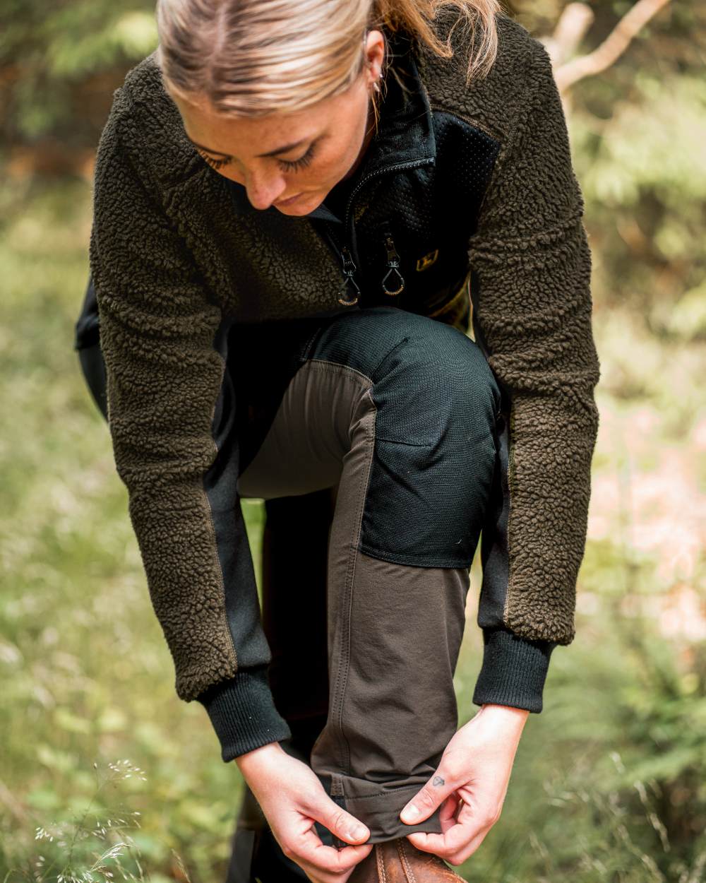 Black Bark Green coloured Northward Trousers on Forest background 