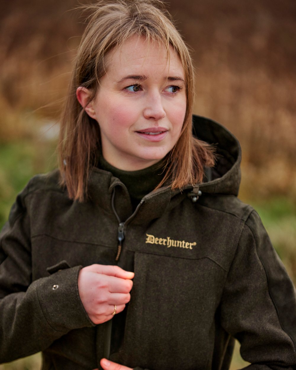 Loden Wood coloured Deerhunter Lady Tatra Active Jacket on Forest background 