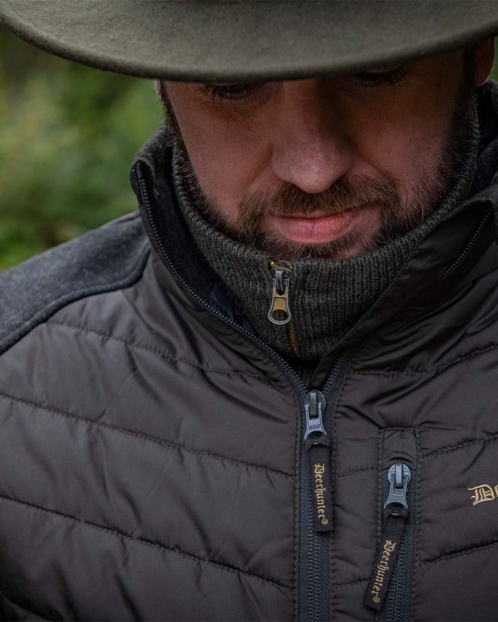 Brown Leaf coloured Deerhunter Moor Padded Jacket with Knitted Sleeves on on Blurry background 