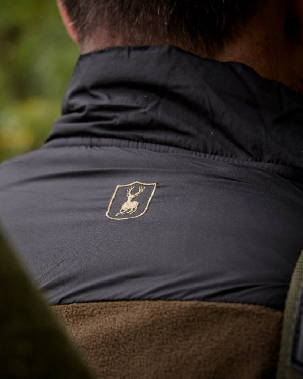 Chestnut Brown coloured Deerhunter Northward Fleece Jacket on blurry background 