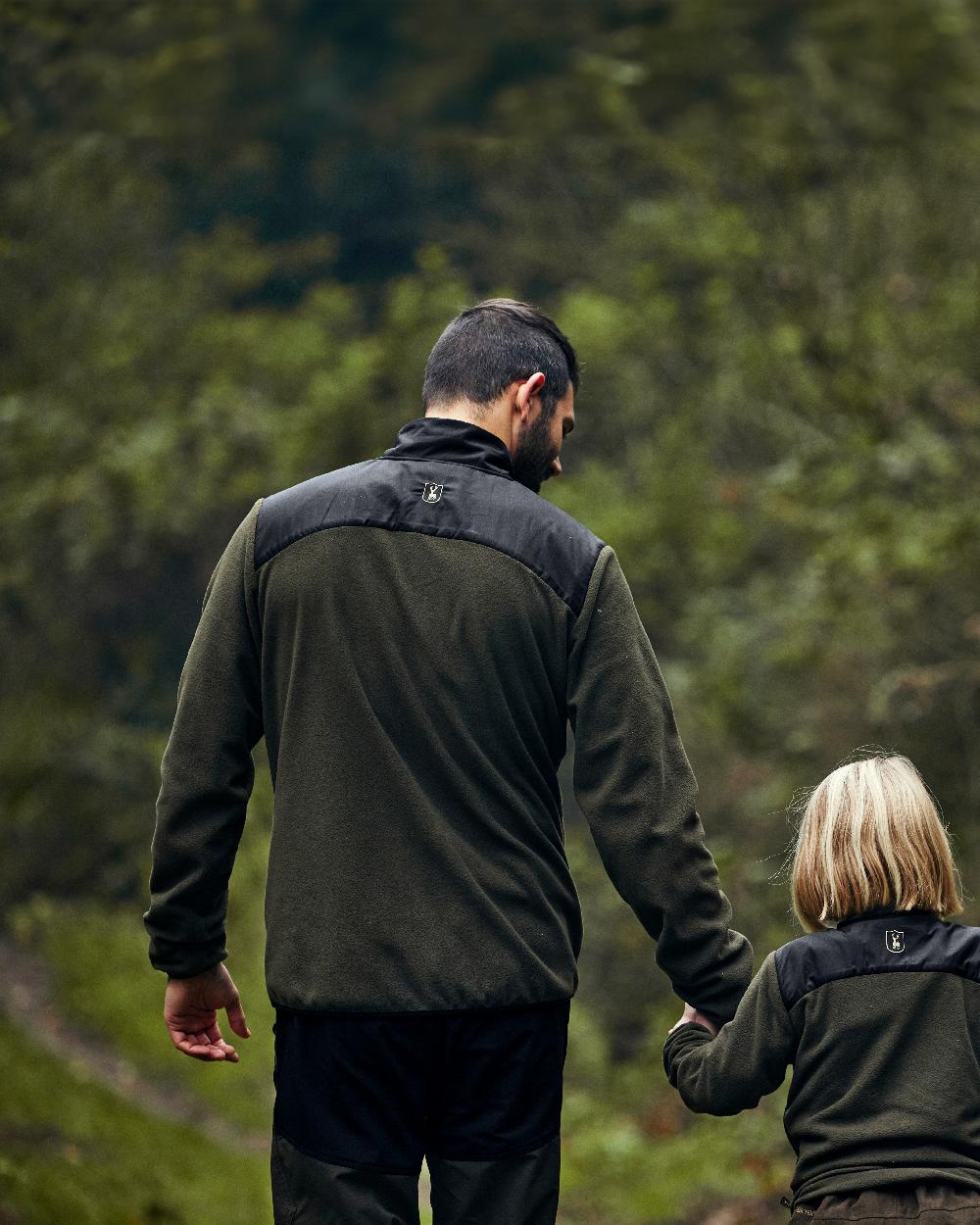 Bark Green Black coloured Deerhunter Northward Trousers on Forest Background 