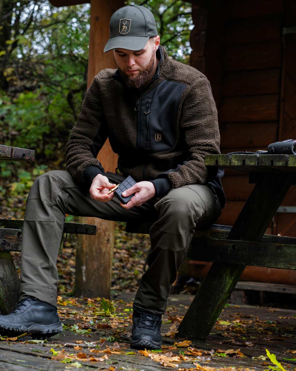 Bark Green coloured Deerhunter Northward Trousers on Outdoor Background 