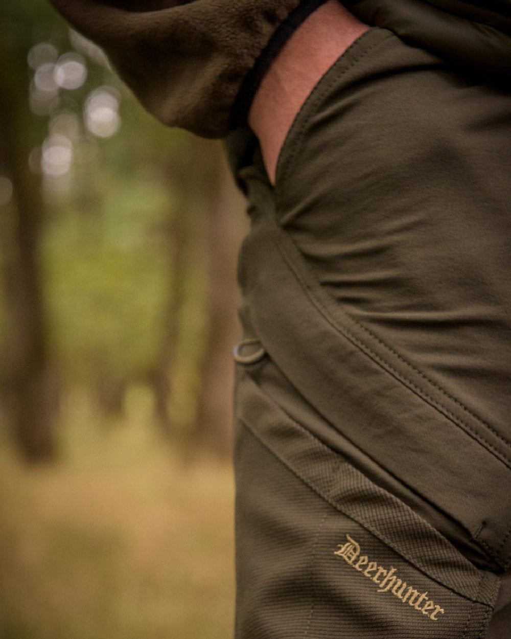 Bark Green coloured Deerhunter Northward Trousers on Blurry Background 
