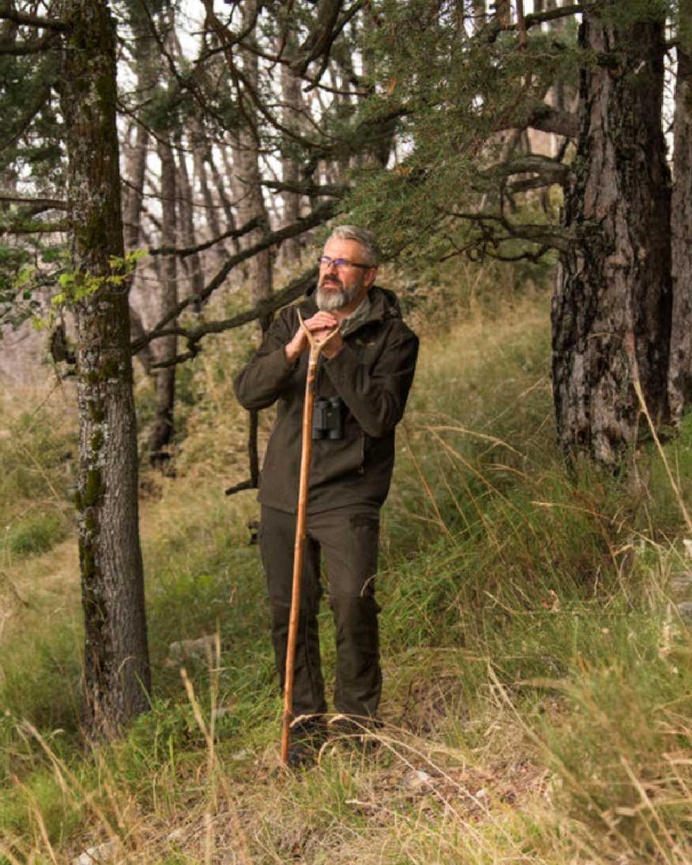 Loden Wood Coloured Deerhunter Tatra Active Jacket On A Forest Background 