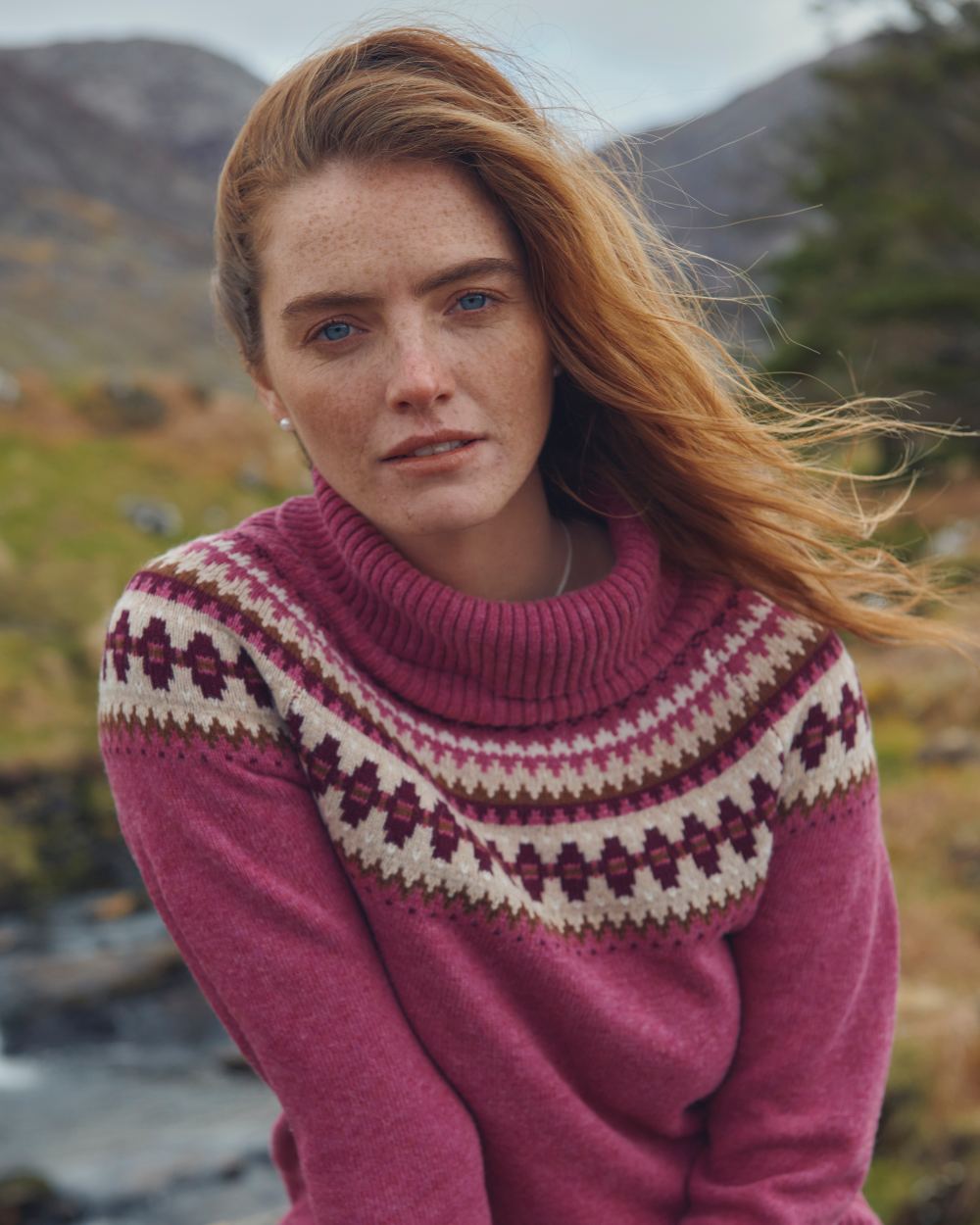 Clover Coloured Dubarry Riverdale Knitted Sweater On A Mountain Background