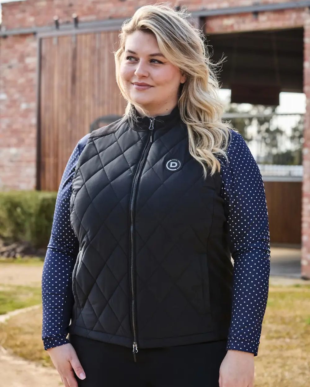 Black Coloured Dublin Curve Quinn Quilted Bodywarmer On A Street Background