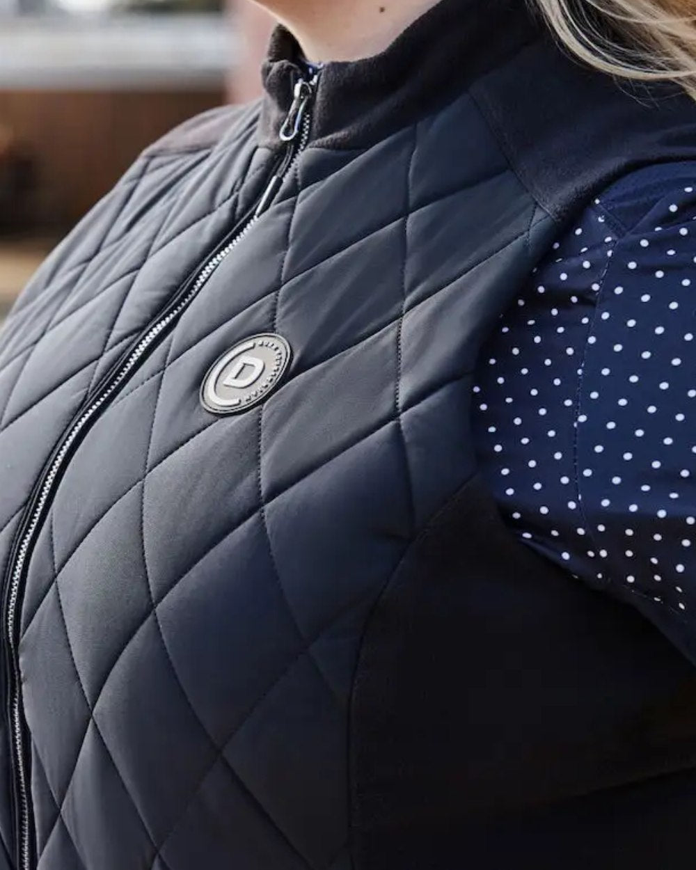 Black Coloured Dublin Curve Quinn Quilted Bodywarmer On A Street Background