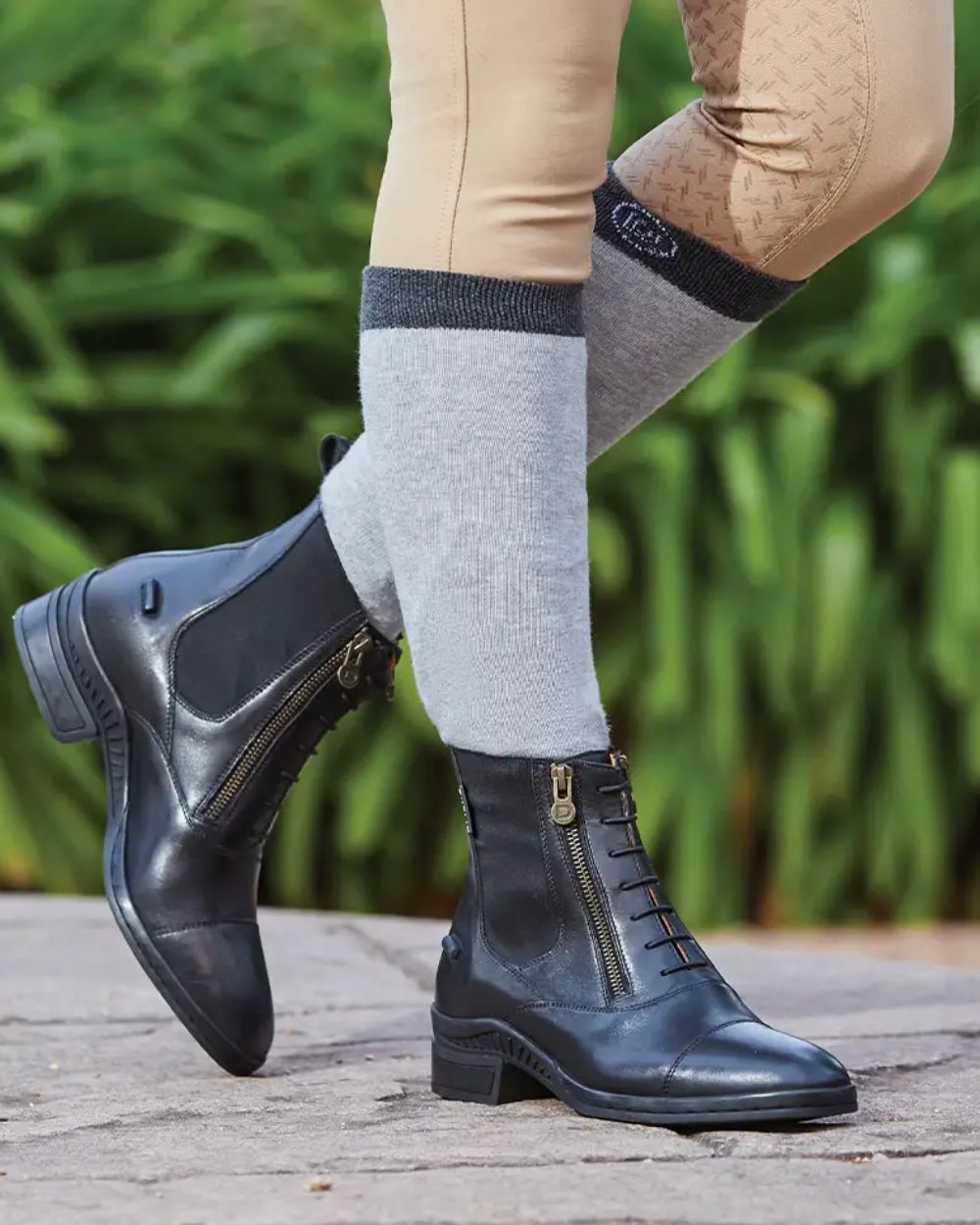 Black Coloured Dublin Paramount Side Zip Paddock Boots On A Field Background 