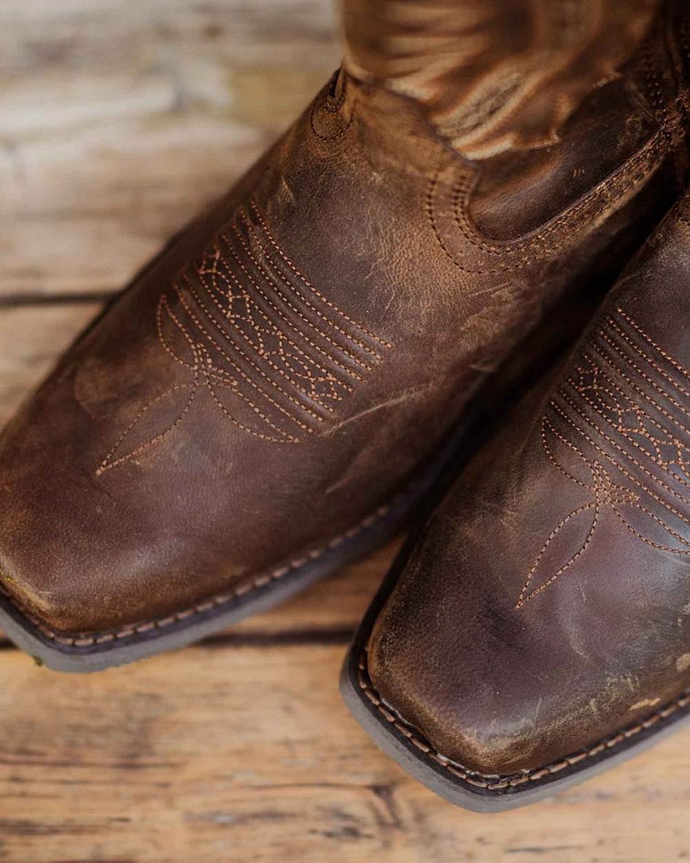 Distressed Sunset Brown Coloured Durango Mens Rebel Frontier Western Boots on Indoor Background
