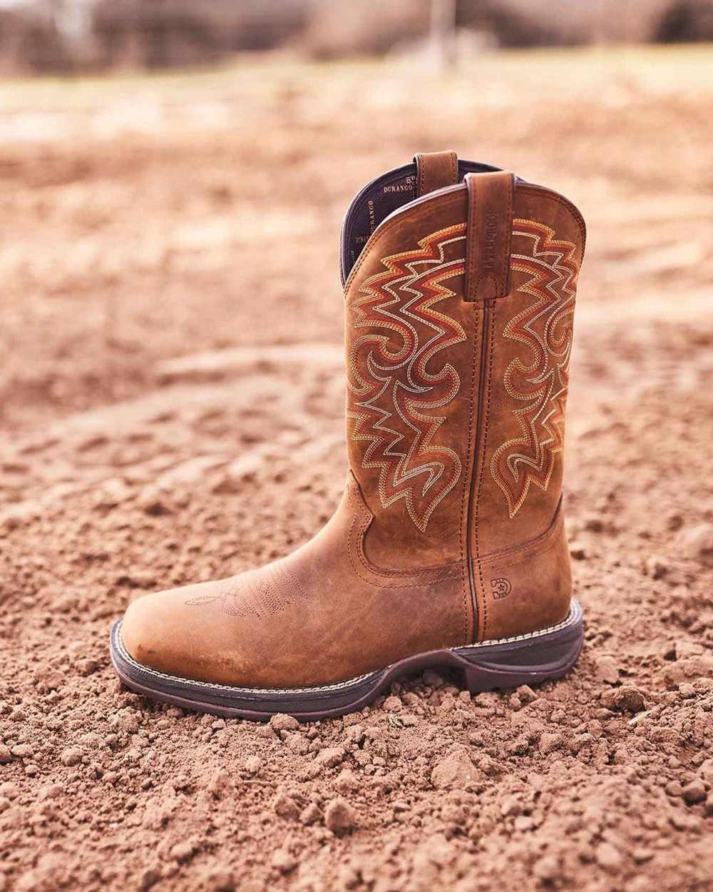 Russet Coloured Durango Mens Rebel Waterproof Western Boots on Outdoor Background
